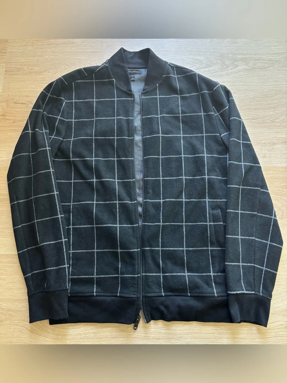 Banana Republic black and white checkerboard zip up jacket.  Size large.
